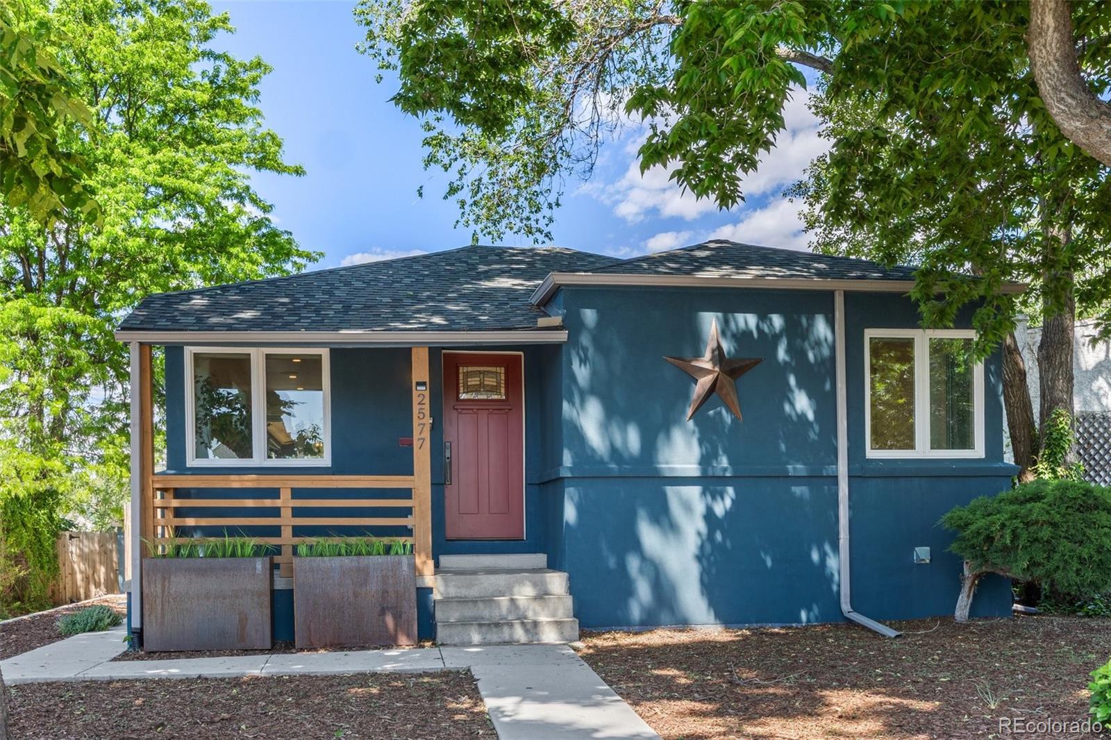 2577 Depew Street Edgewater, CO 80214 - Photo 36 of 47 a front view of a house with a yard