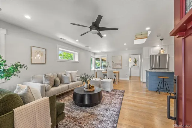 a living room with furniture or couch and a potted plant