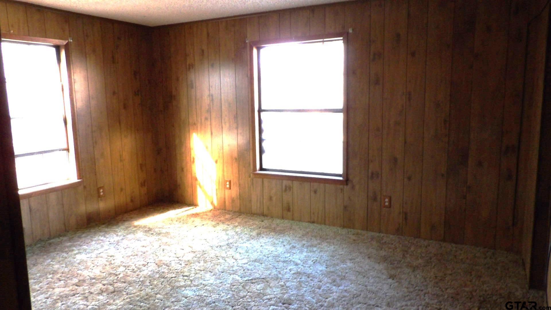 705 Wiley Boulevard Big Sandy, TX 75755 - Photo 12 of 17 a view of an empty room and window