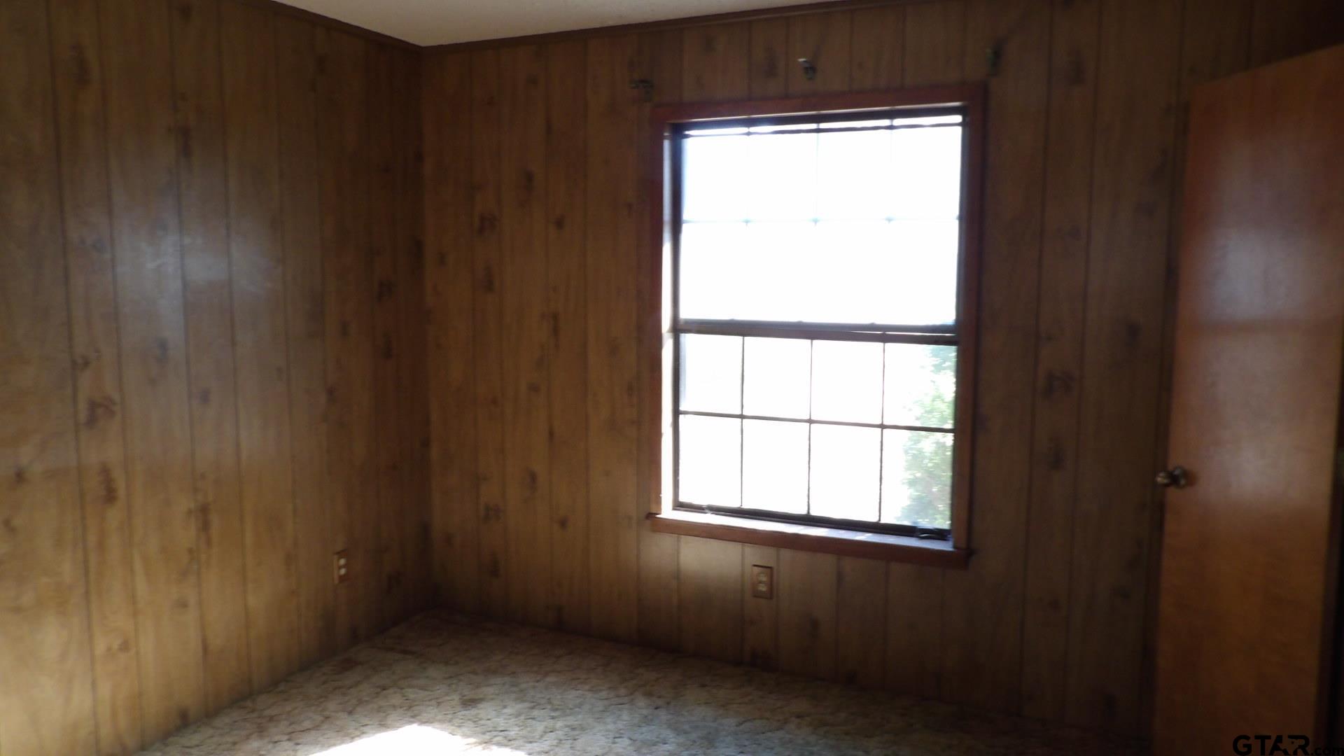 705 Wiley Boulevard Big Sandy, TX 75755 - Photo 14 of 17 an empty room with a window