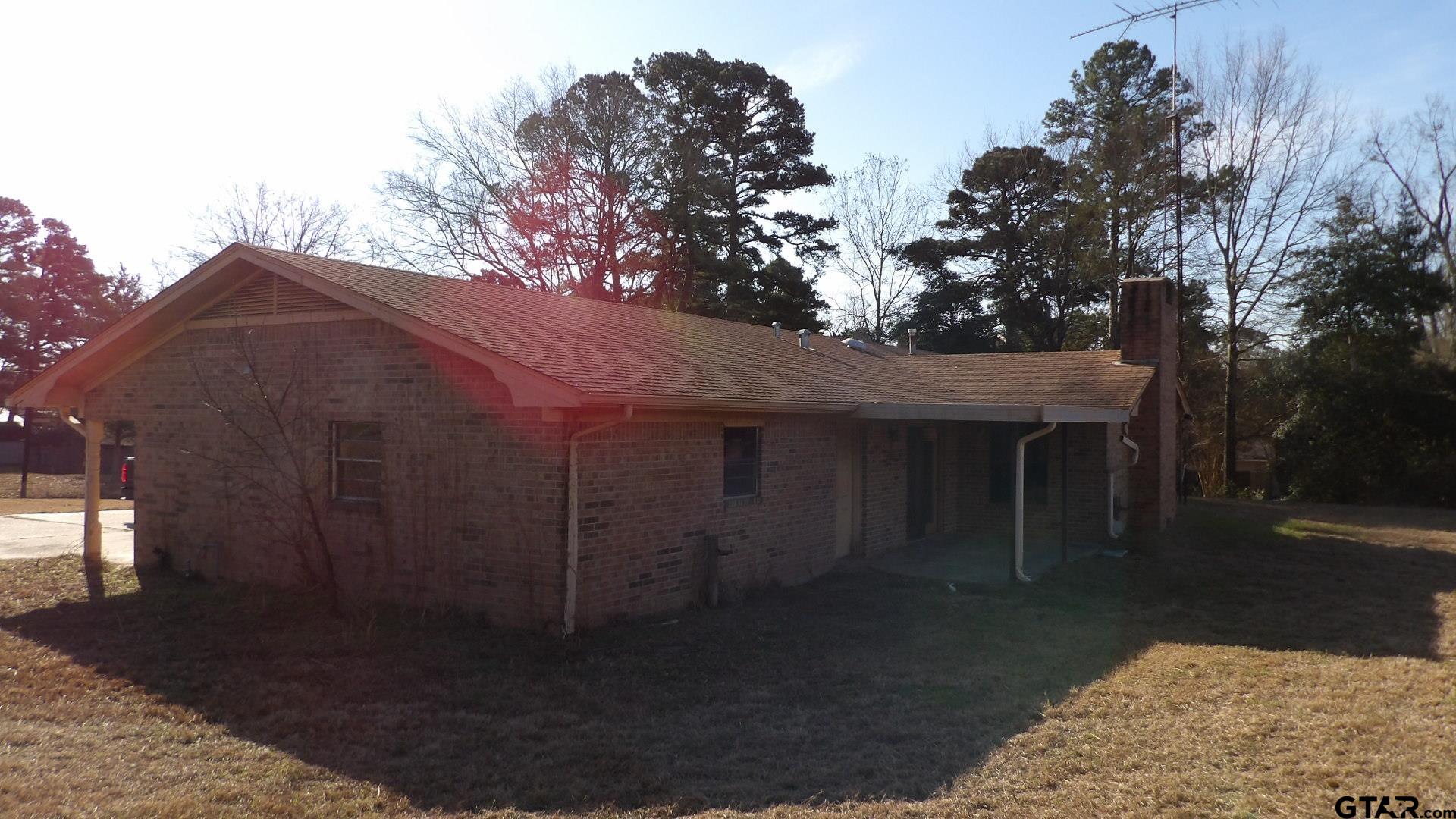 705 Wiley Boulevard Big Sandy, TX 75755 - Photo 17 of 17 a backyard of a house with lots of green space