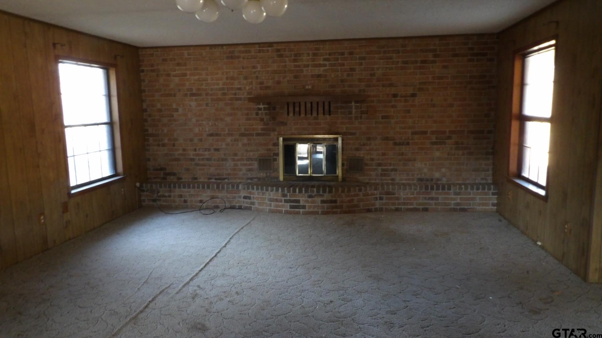 705 Wiley Boulevard Big Sandy, TX 75755 - Photo 4 of 17 a view of an empty room with a window
