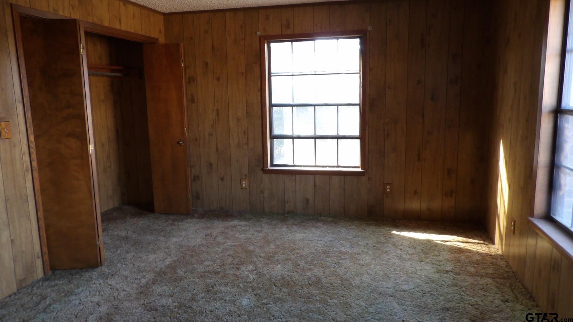 705 Wiley Boulevard Big Sandy, TX 75755 - Photo 9 of 17 an empty room with windows