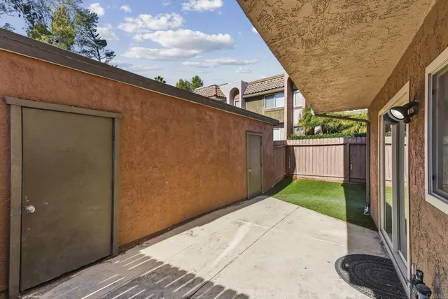 a backyard of a house with a garden