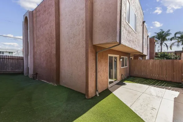 a view of a door with a sink and a yard