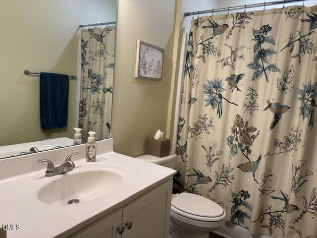 574 East Ridge Avenue Liberty, NC 27298 - Photo 17 of 28 a bathroom with a sink toilet and shower