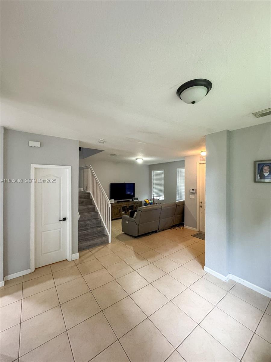 27841 Southwest 140th Avenue Homestead, FL 33032 - Photo 14 of 28 a view of a livingroom with furniture and cabinet