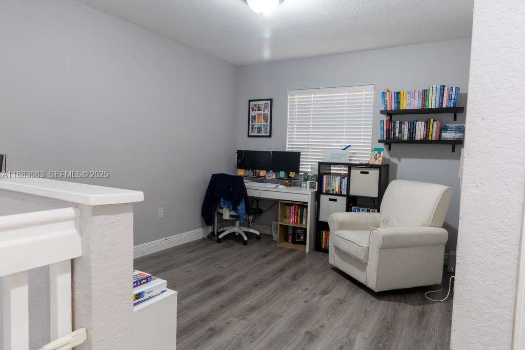 27841 Southwest 140th Avenue Homestead, FL 33032 - Photo 15 of 28 a living room with furniture and a wooden floor