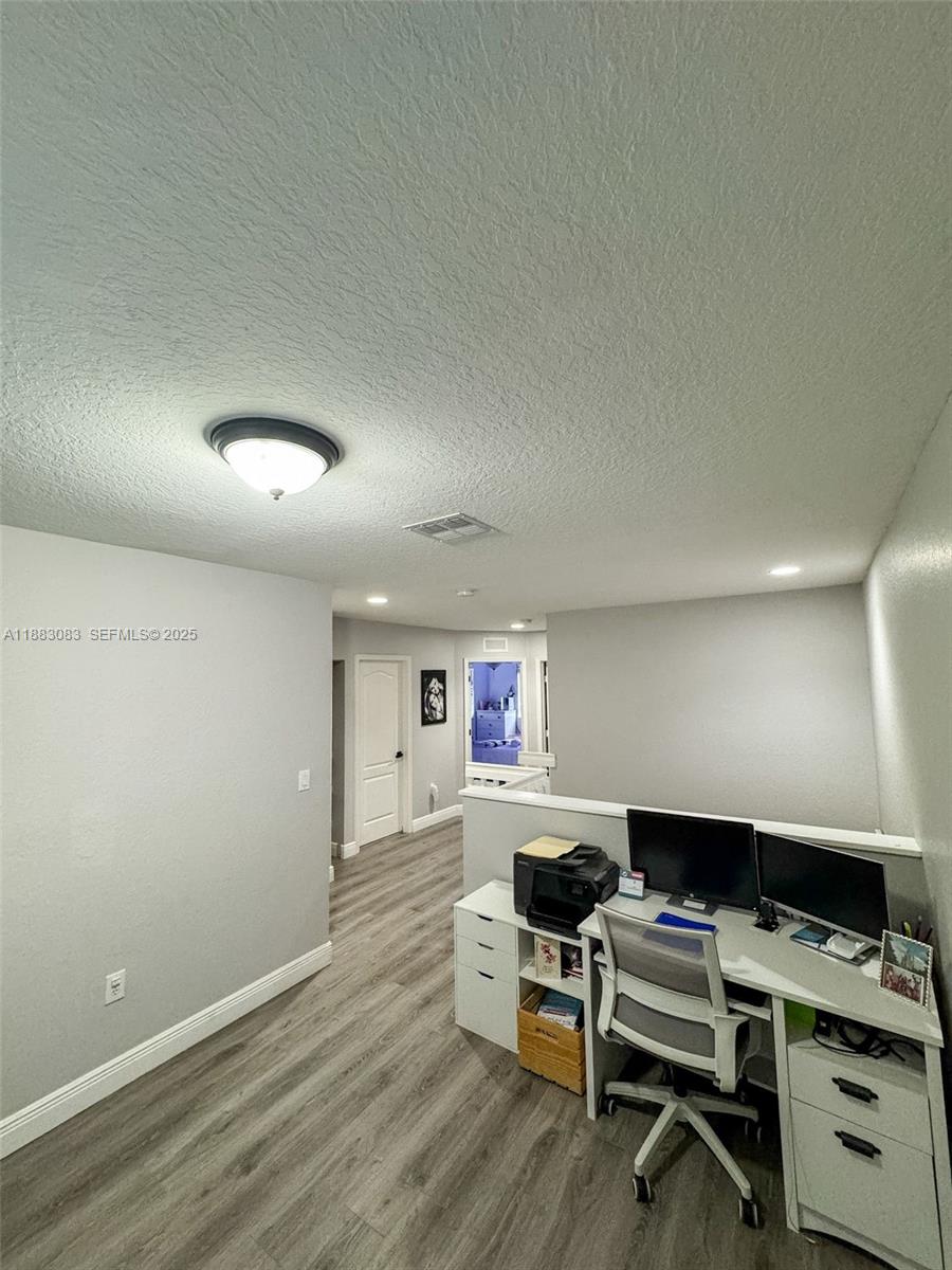 27841 Southwest 140th Avenue Homestead, FL 33032 - Photo 16 of 28 a workspace with furniture