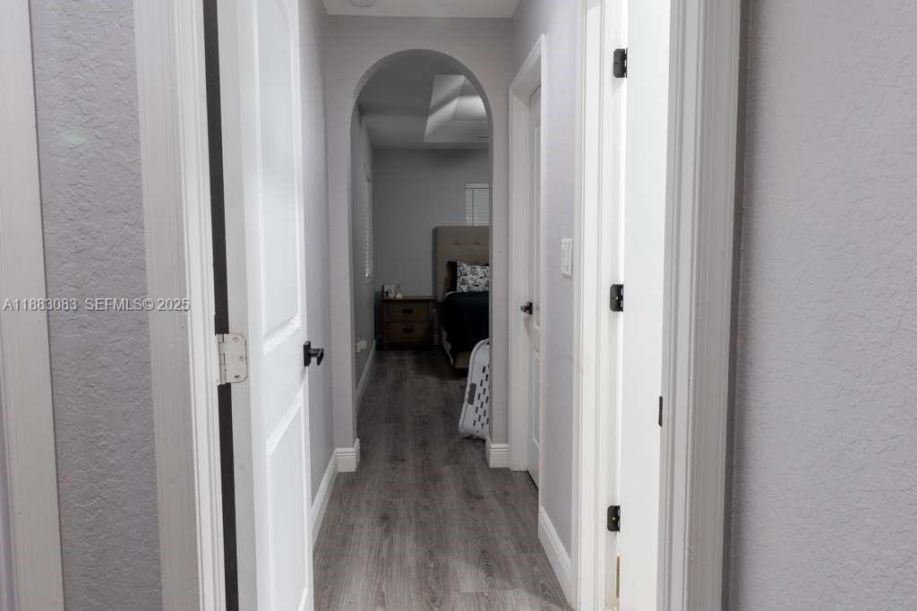 27841 Southwest 140th Avenue Homestead, FL 33032 - Photo 20 of 28 a view of a livingroom from a hallway