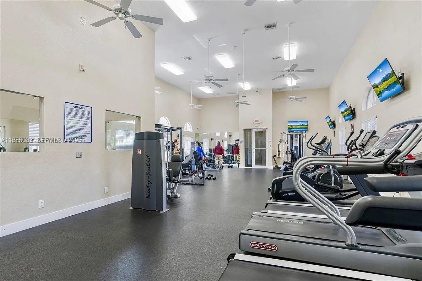 27841 Southwest 140th Avenue Homestead, FL 33032 - Photo 25 of 28 a view of a room with gym equipment