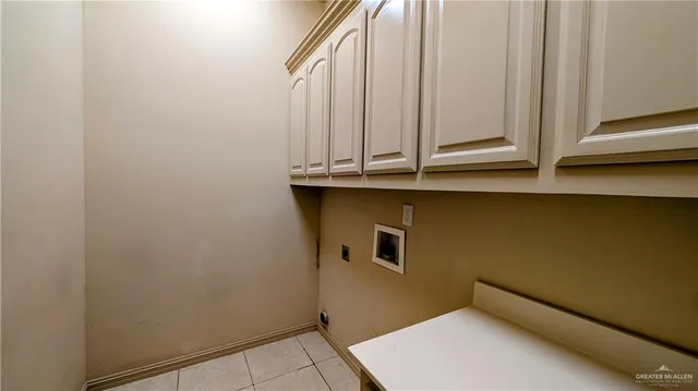a bathroom with a sink and cabinets