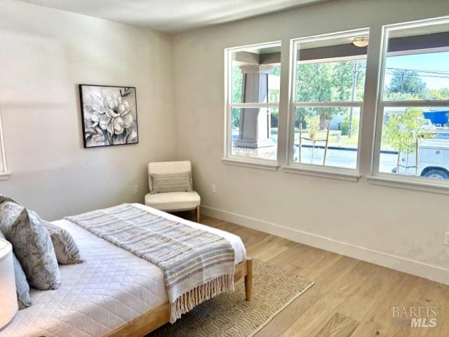 3461 Ruston Lane Napa, CA 94558 - Photo 7 of 22 a bedroom with a large bed and a large window