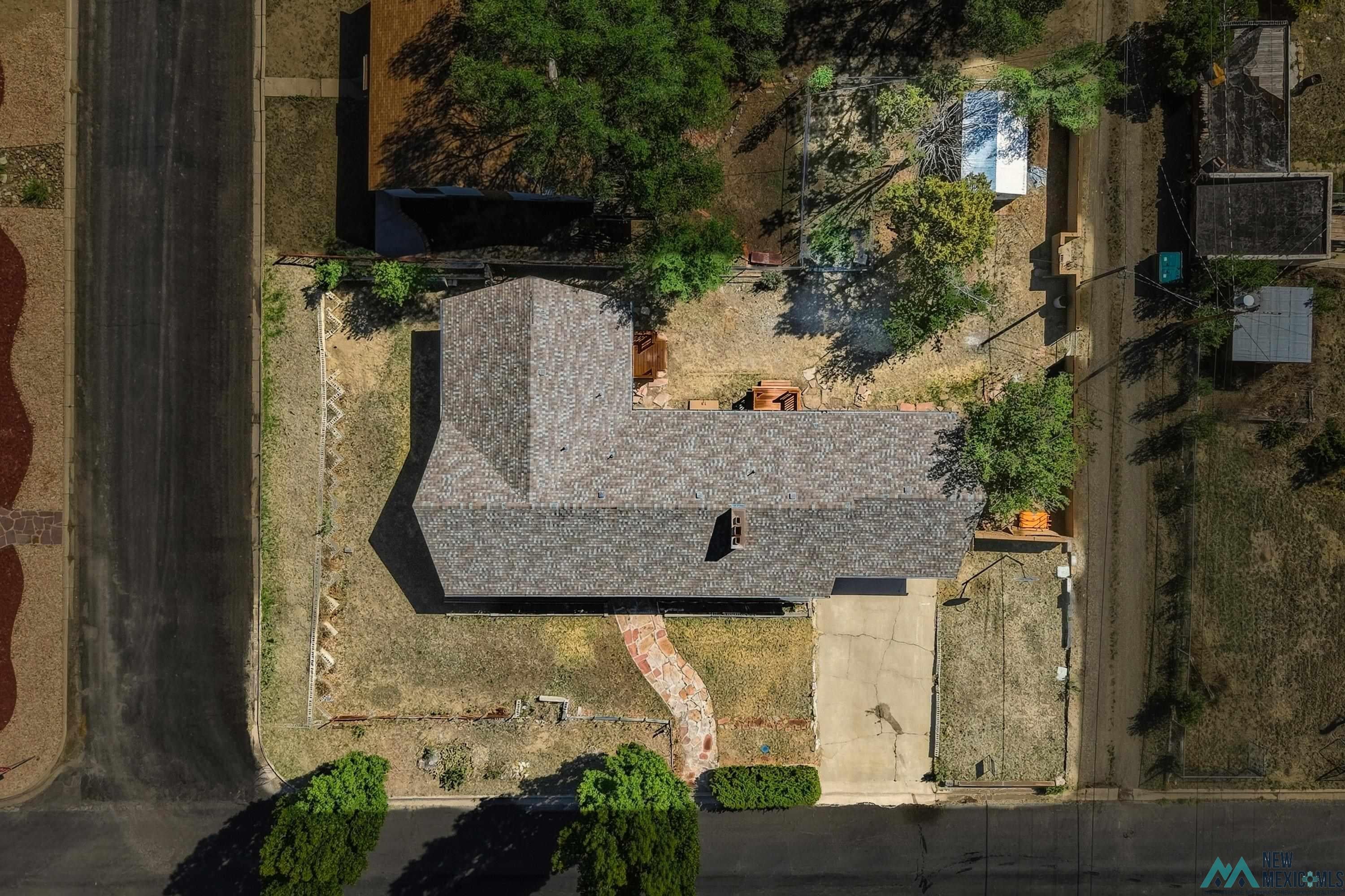 544 South 13th Avenue Raton, NM 87740 - Photo 33 of 37 Gabled roofline with asphalt shingles
