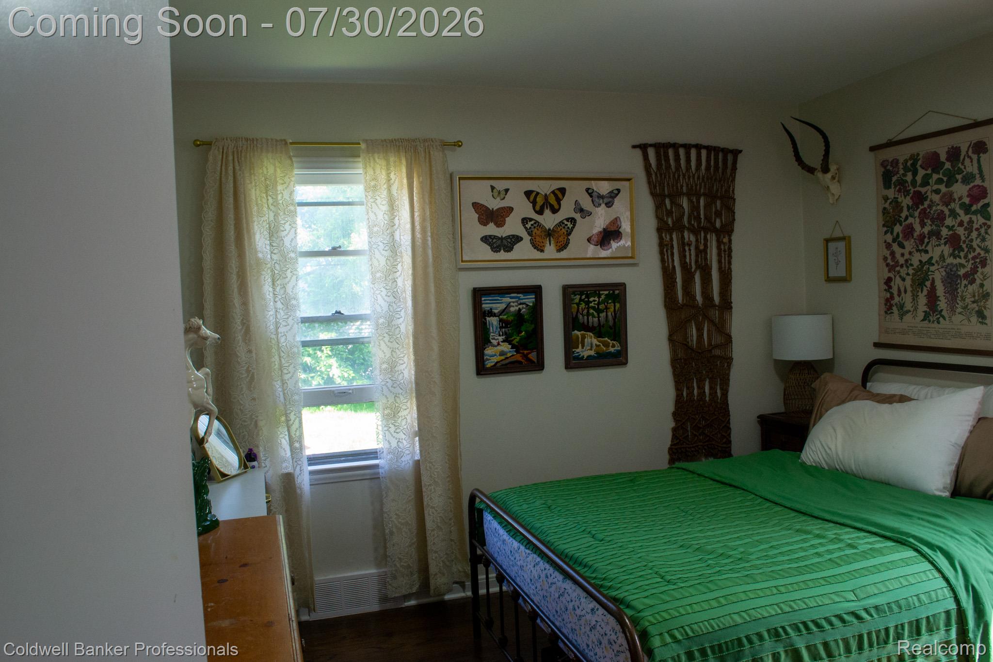 18441 Frazho Road Roseville, MI 48066 - Photo 12 of 23 Double-hung window featuring white trim and a gold-toned curtain rod