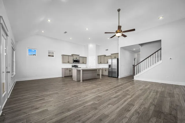 a kitchen with stainless steel appliances a stove a sink and a refrigerator