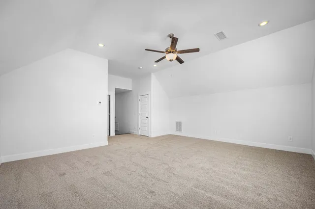 a bathroom with a granite countertop sink a toilet a mirror and shower