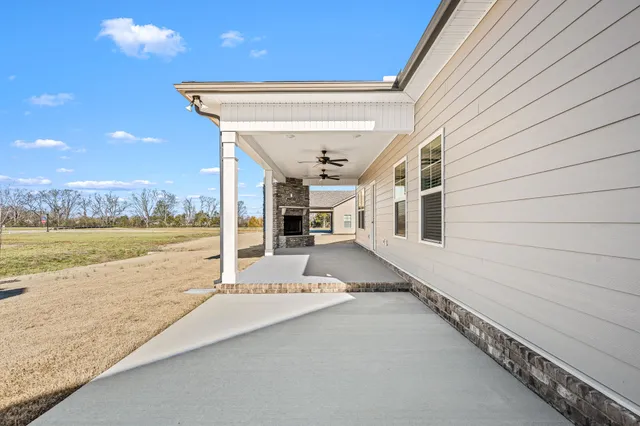 a view of a living room and a floor to ceiling window