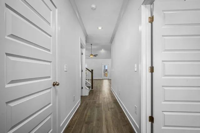 a view of a small space with wooden floor