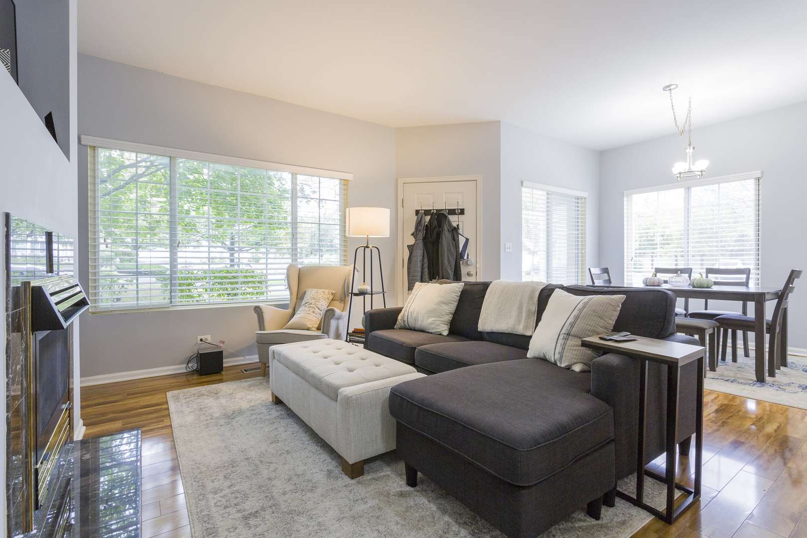 147 Heather Glen Drive, Unit 147 Aurora, IL 60504 - Photo 5 of 14 a living room with furniture and a large window