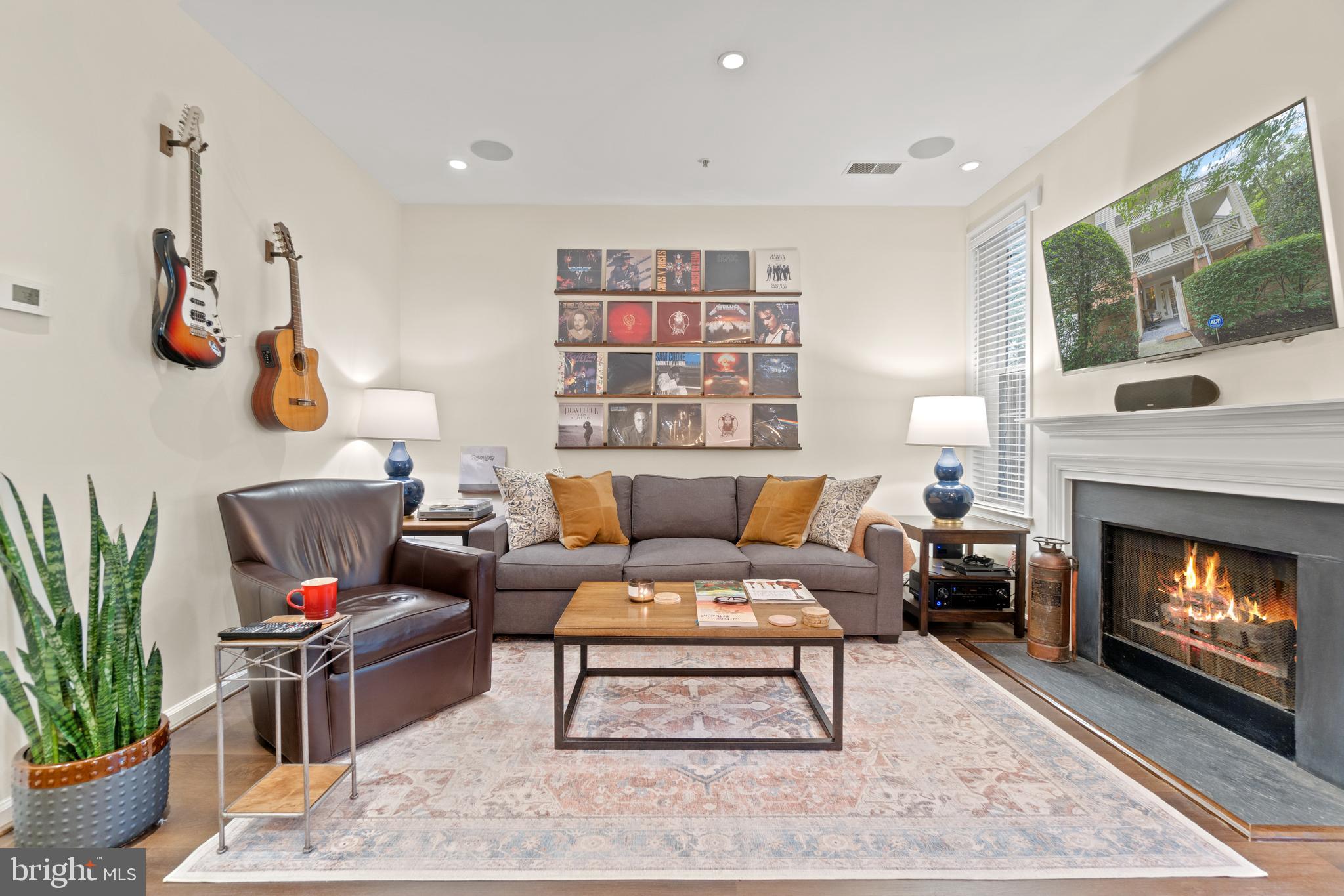 1301 Garden Wall Court, Unit 901 Reston, VA 20194 - Photo 6 of 30 Family room with Gas Fireplace and surround sound
