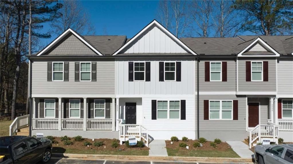 a front view of a house with a yard