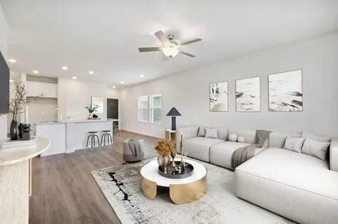 519 Ridgedale Drive McKinney, TX 75071 - Photo 13 of 26 a living room with furniture and a wooden floor