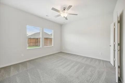 519 Ridgedale Drive McKinney, TX 75071 - Photo 16 of 26 an empty room with ceiling fan and window