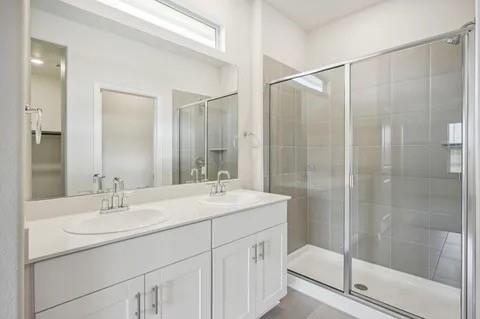 519 Ridgedale Drive McKinney, TX 75071 - Photo 19 of 26 a bathroom with a shower sink and mirror
