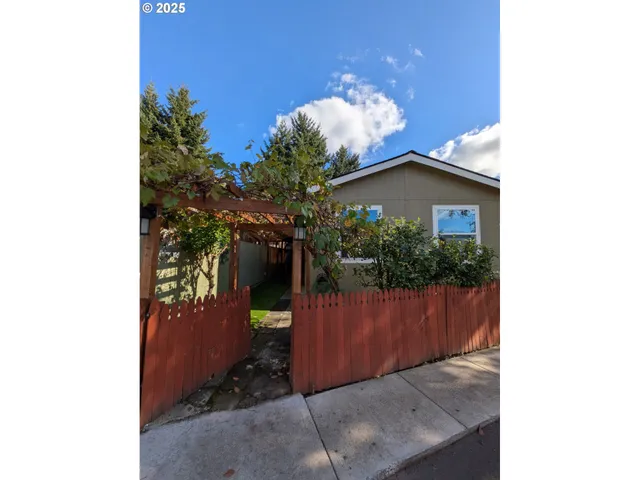 a view of a house with a flower garden