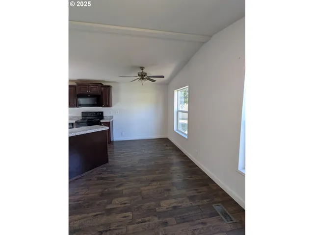 a view of a hallway with a white walls