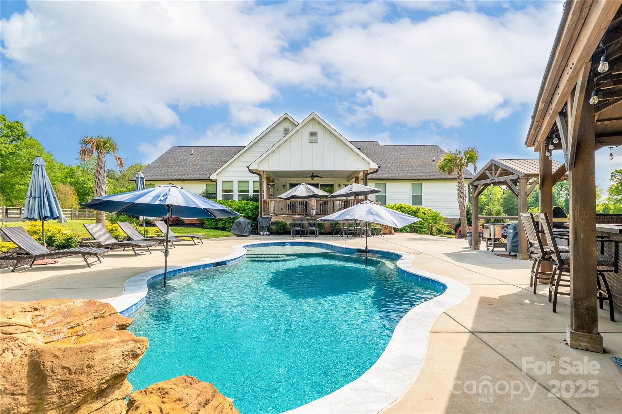 754 Culp Fergusen Drive Lancaster, SC 29720 - Photo 32 of 35 a swimming pool with outdoor seating and yard