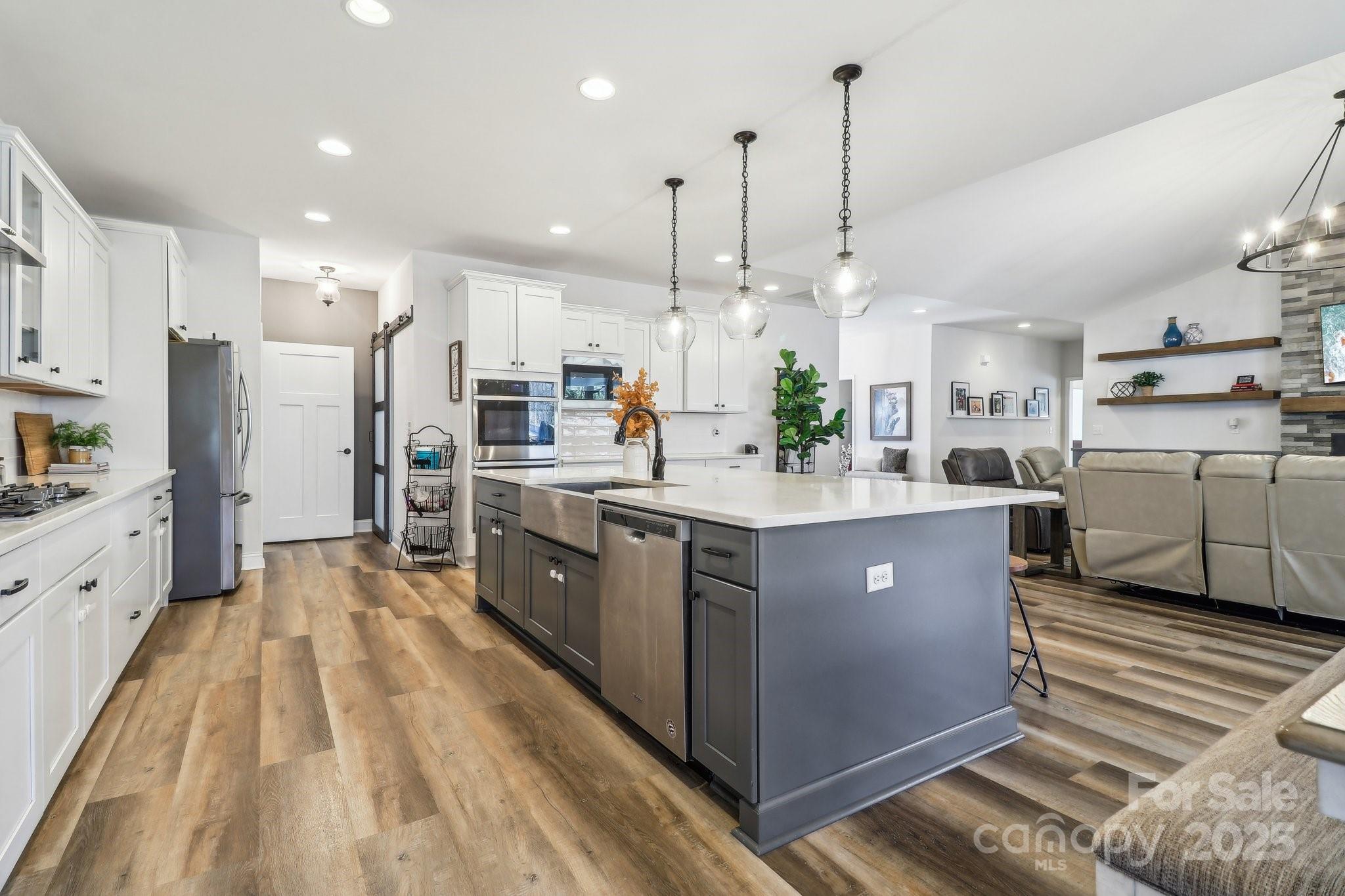 754 Culp Fergusen Drive Lancaster, SC 29720 - Photo 5 of 35 a kitchen with stainless steel appliances kitchen island granite countertop a sink and a refrigerator