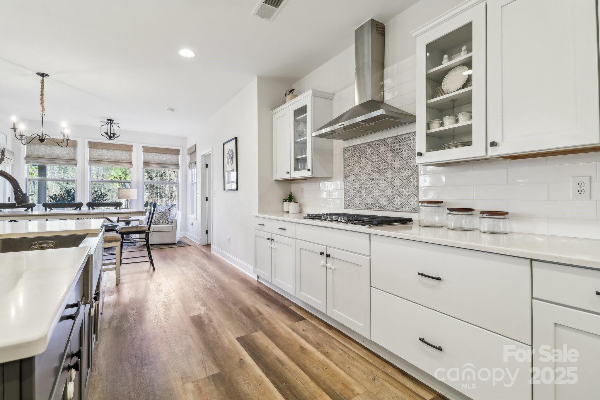 754 Culp Fergusen Drive Lancaster, SC 29720 - Photo 6 of 35 a kitchen with stainless steel appliances granite countertop a lot of counter space and wooden floors