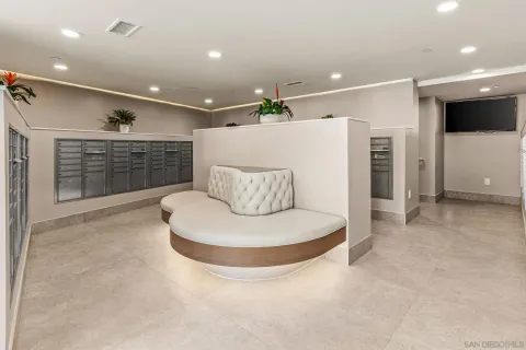 a large living room with a large window and a flat screen tv