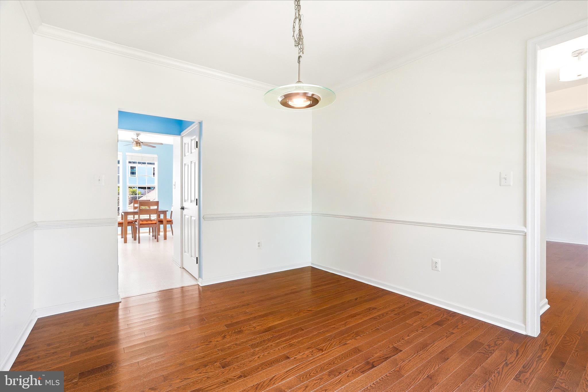 9009 Bealls Farm Road Frederick, MD 21704 - Photo 12 of 41 a view of a room with wooden floor and white walls