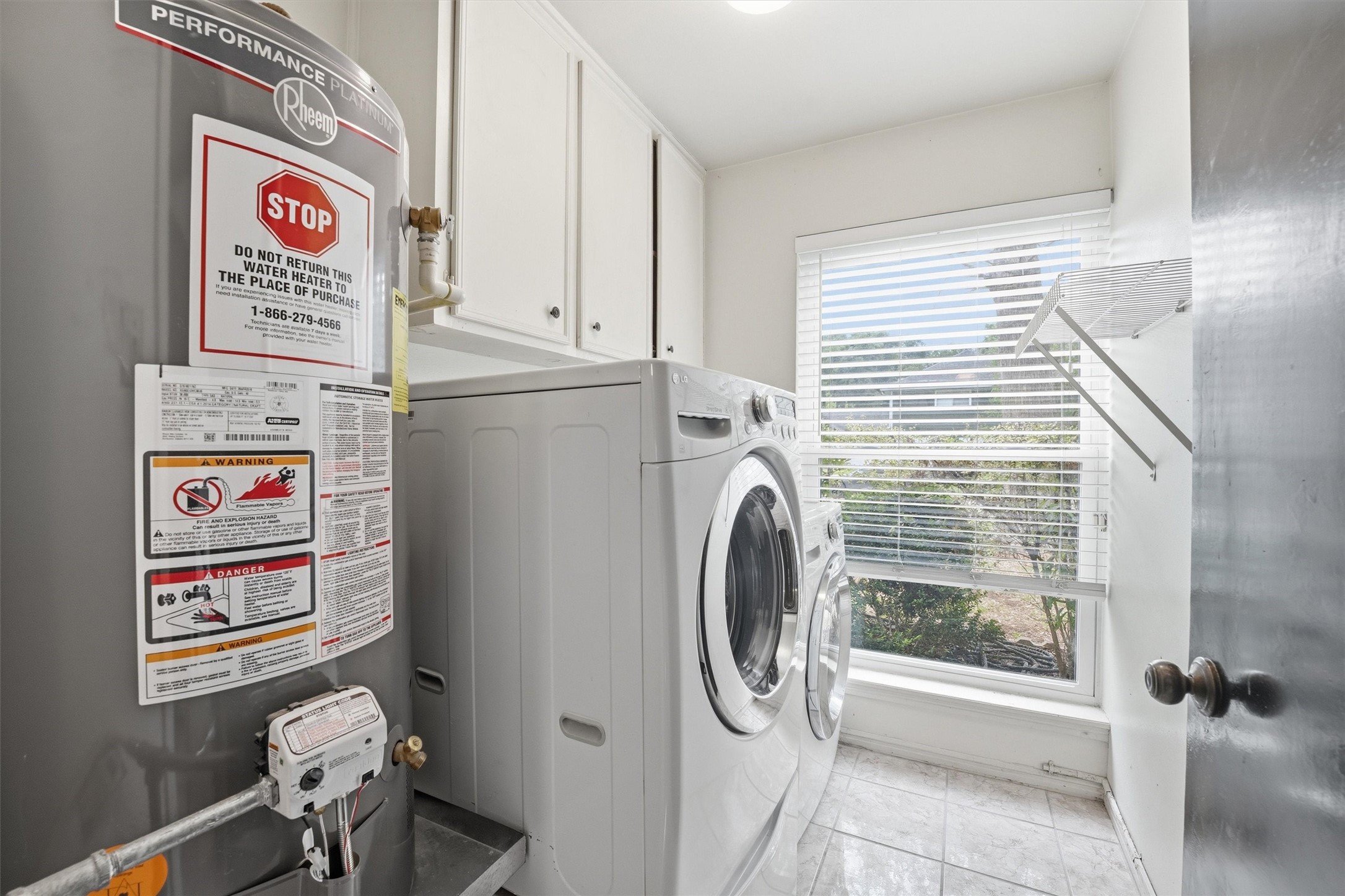 8115 Theisswood Road Spring, TX 77379 - Photo 29 of 41 utility room with washer dryer included