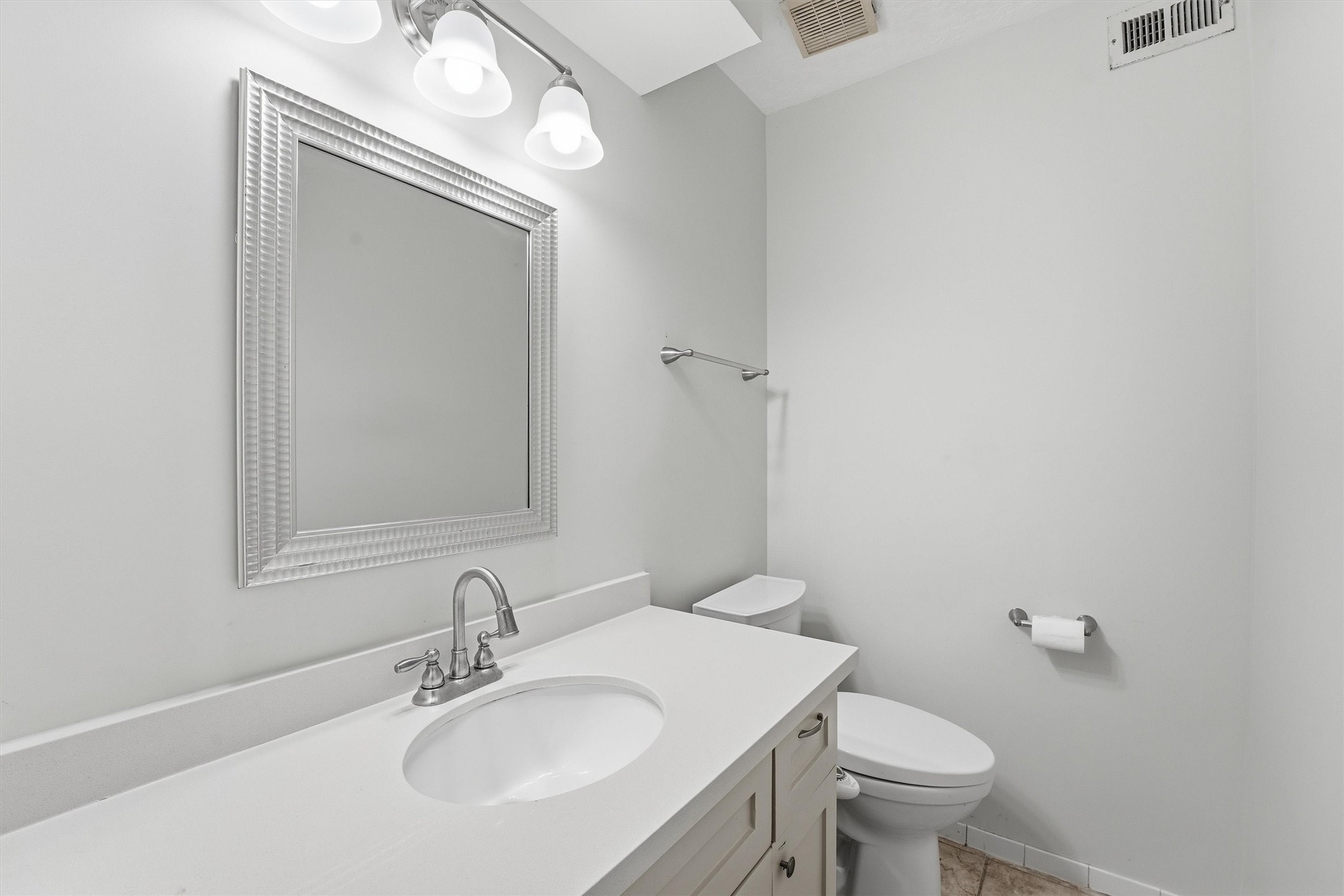 8115 Theisswood Road Spring, TX 77379 - Photo 9 of 41 A conveniently located, updated half bathroom on the main floor featuring a crisp white vanity