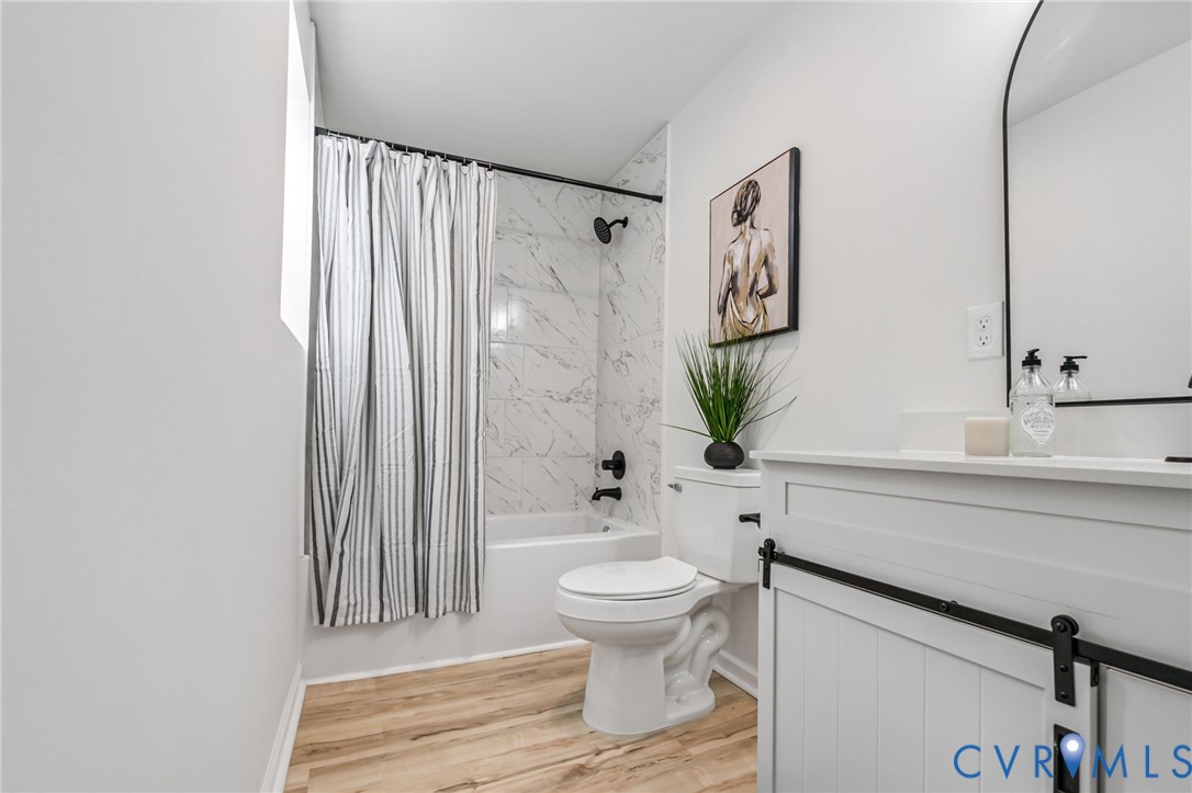21514 Pannill Street Petersburg, VA 23803 - Photo 11 of 21 a bathroom with a toilet sink and shower