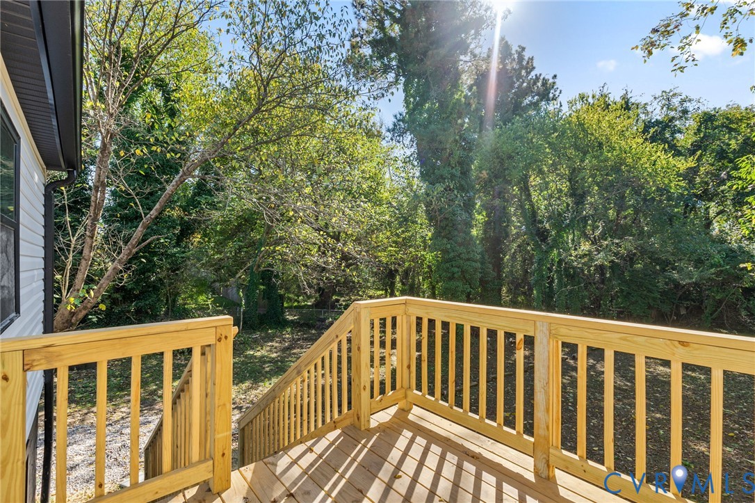 21514 Pannill Street Petersburg, VA 23803 - Photo 20 of 21 a view of balcony with wooden floor and fence