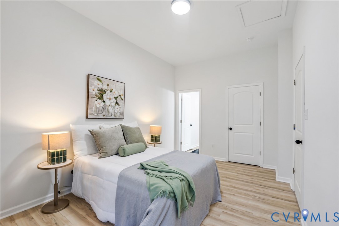 21514 Pannill Street Petersburg, VA 23803 - Photo 8 of 21 a bedroom with a bed and painting on the wall