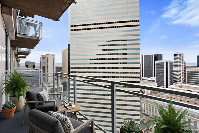 a view of a balcony with furniture