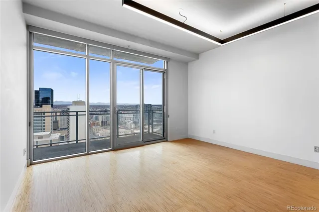 a view of an empty room with a balcony