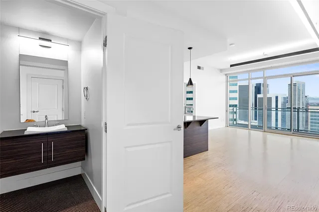 a bathroom with a tub sink and mirror