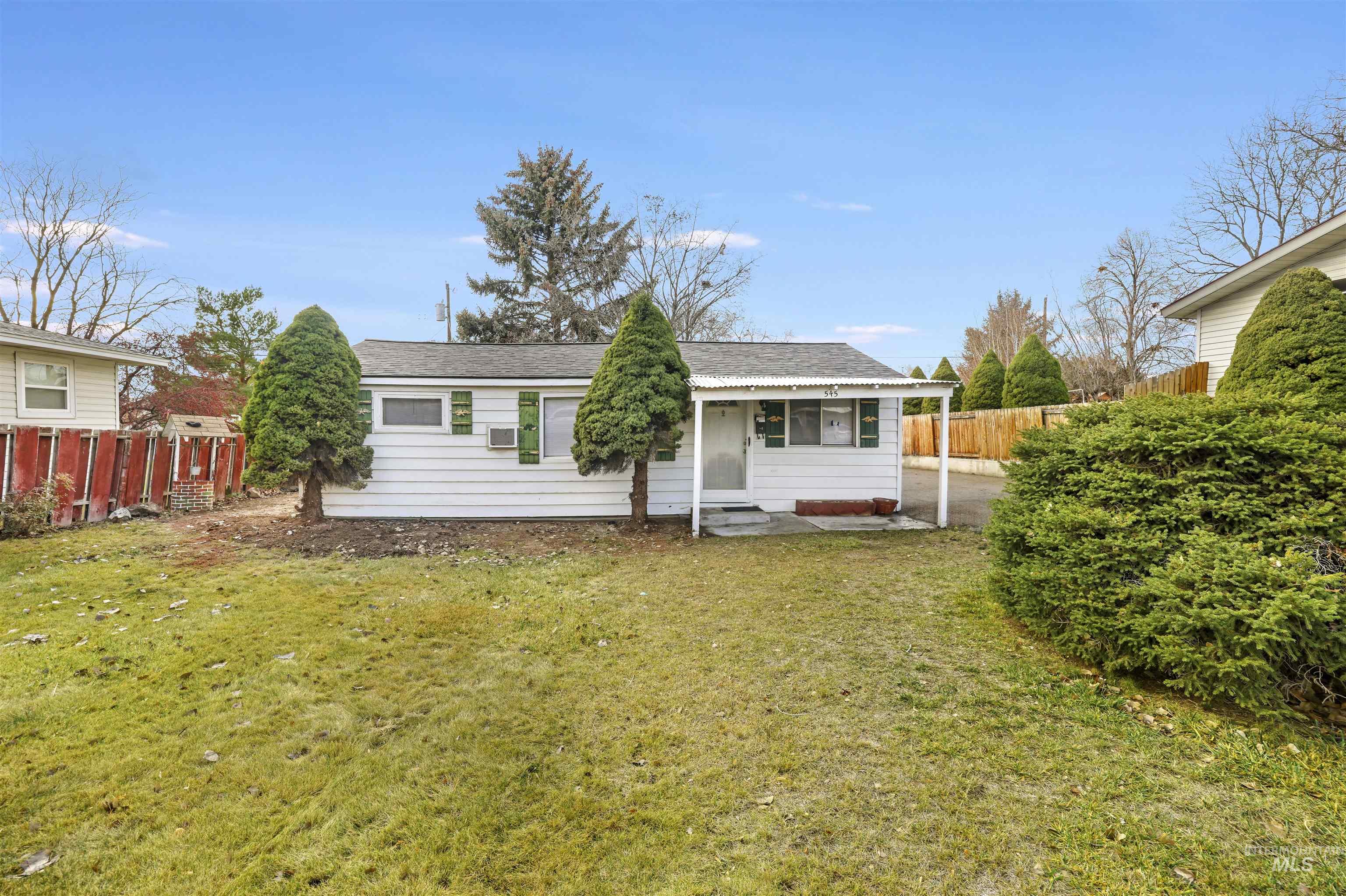 Rear view of property with a shingled roof