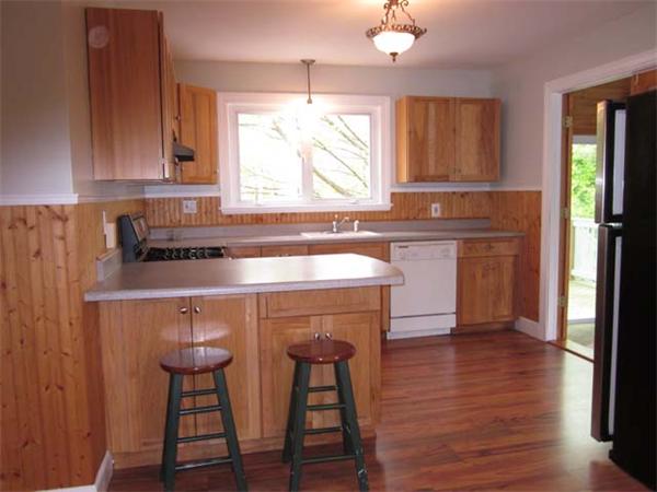 57 Prospect Road Andover, MA 01810 - Photo 5 of 14 a kitchen with stainless steel appliances a sink cabinets and wooden floor