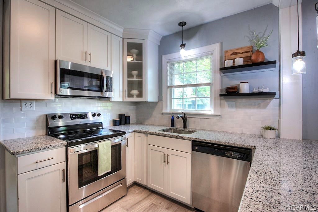 2205 Newman Road Richmond, VA 23231 - Photo 14 of 30 New, white cabinetry and timeless subway tile back