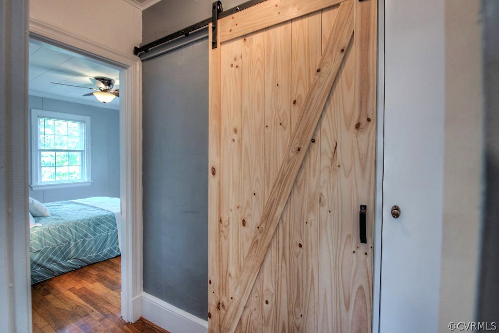 2205 Newman Road Richmond, VA 23231 - Photo 20 of 30 This marvelous natural barn door leads to the wond