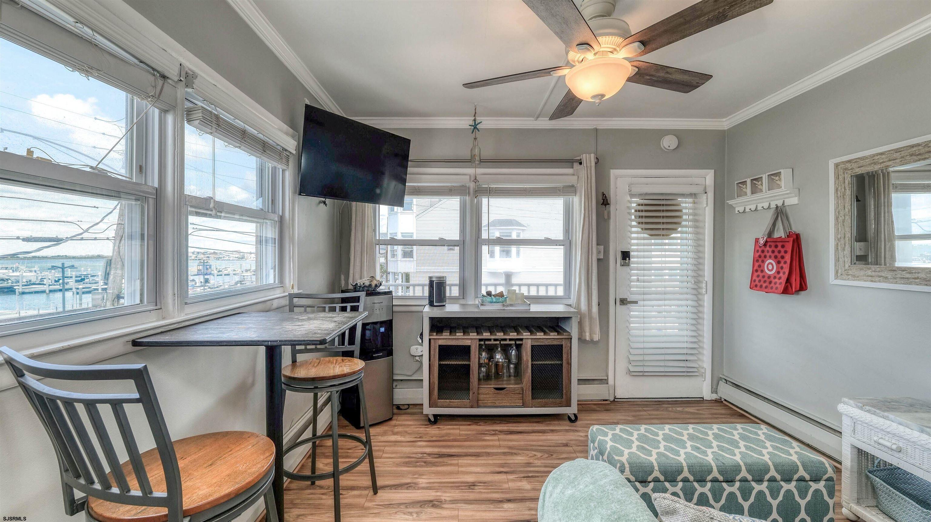 9500 Amherst Avenue, Unit 10 AKA 9 Margate City, NJ 08402 - Photo 6 of 20 a dining room with furniture and window