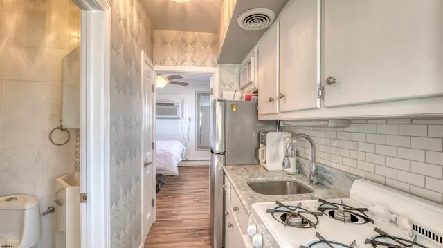 a bathroom with a sink and toilet